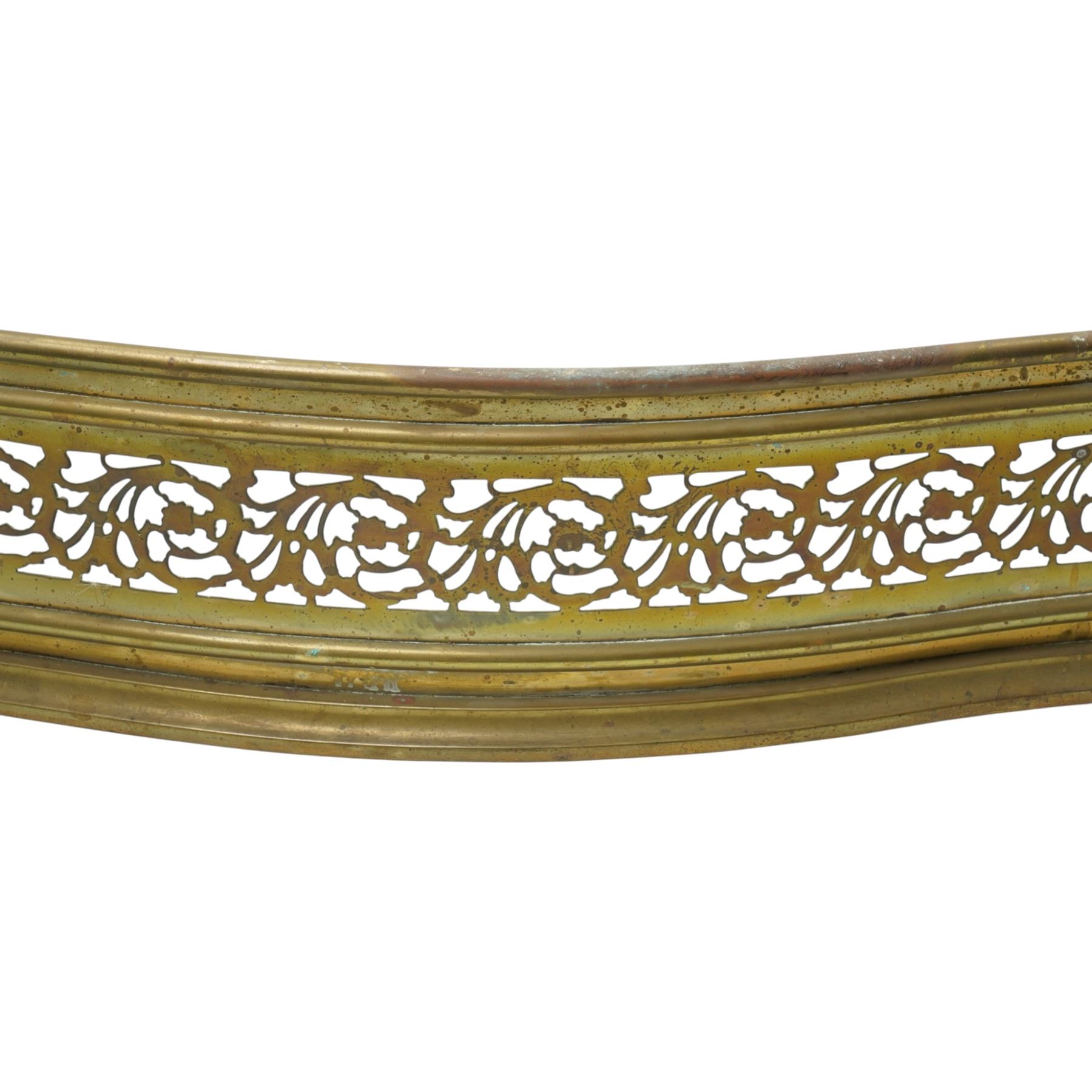 19th century brass fire curb of serpentine outline with pierced decoration W153cm