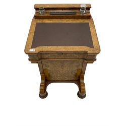 Late Victorian figured walnut davenport, raised pen and ink compartment over hinged sloped lid, four working drawers to right hand side, compressed turned bun feet with recessed castors