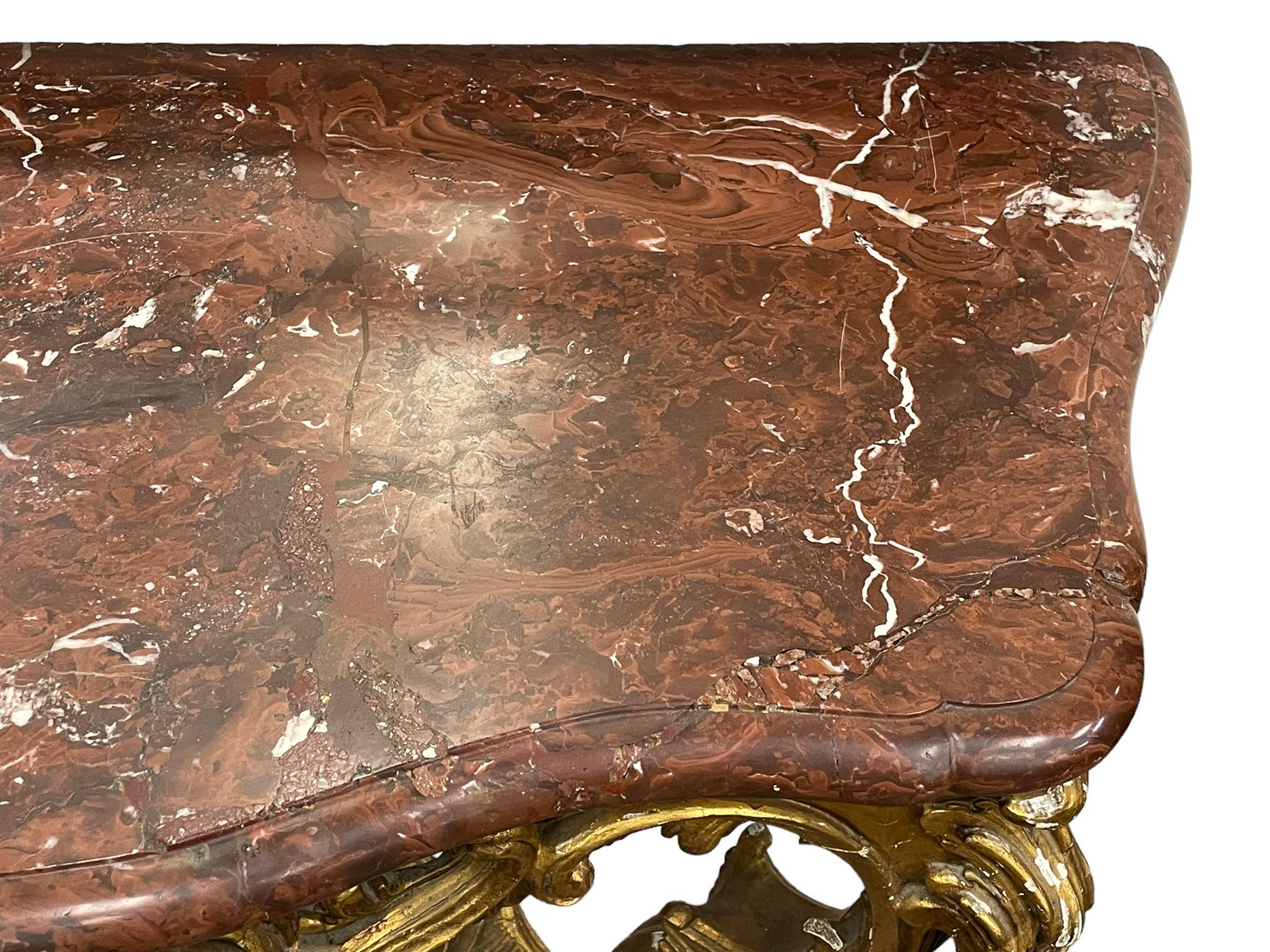 19th century giltwood and gesso console table, shaped variegated rouge marble top with moulded edge, central shell motif with extending scrolled foliage, on foliate and flower head moulded cabriole supports united by pierced shell middle rail, scrolled acanthus leaf terminals 