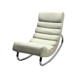 Cream leather modernist rocking chair, leather upholstery with horizontal channel stitching, supported by a chrome-plated tubular frame 