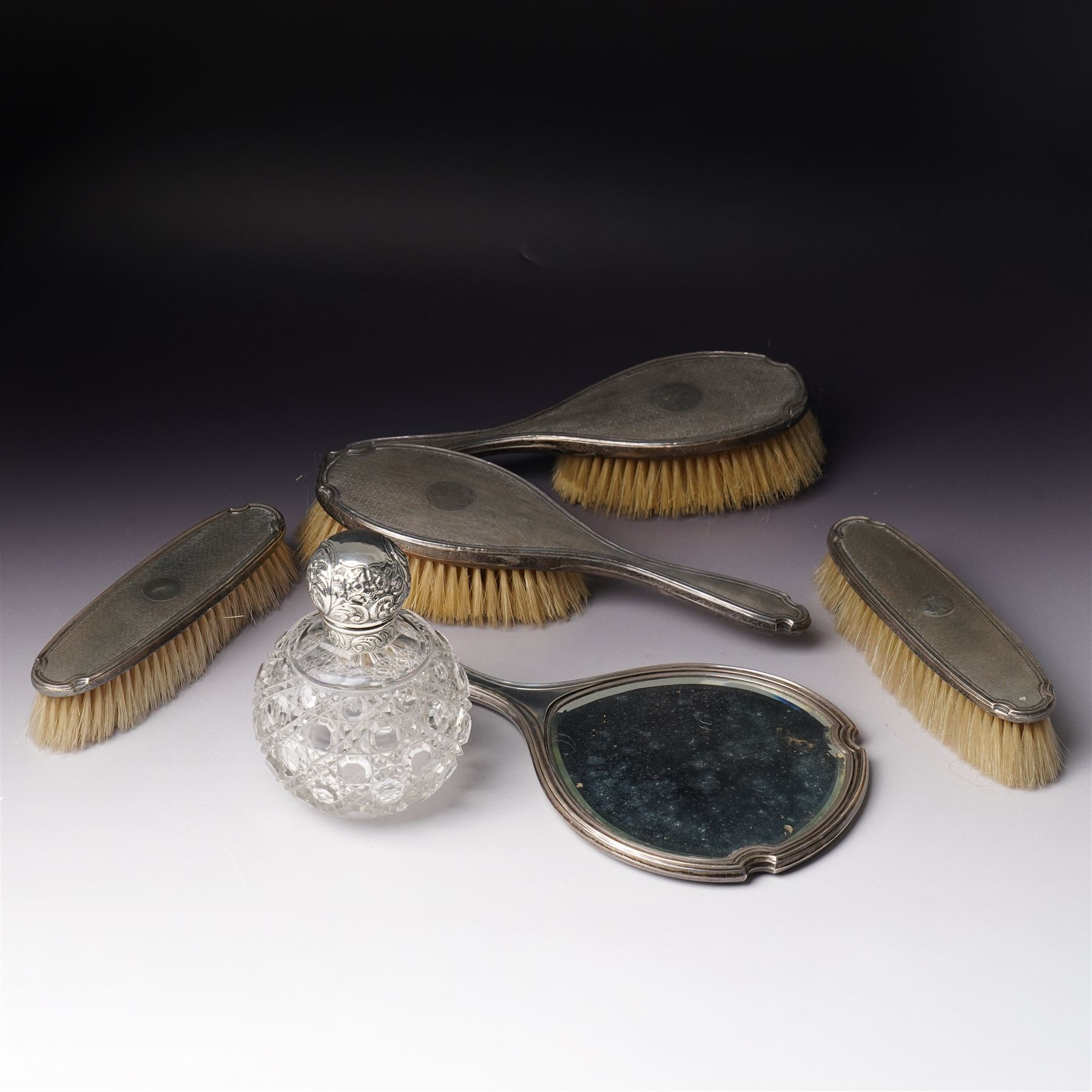 Five piece silver backed dressing table set Birmingham 1929 Maker Deakin & Francis Ltd and a Victorian glass globe scent flask with screw off silver cover  