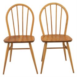 Ercol - set of four 'Windsor' waxed elm chairs, with hoop back design, on tapering supports