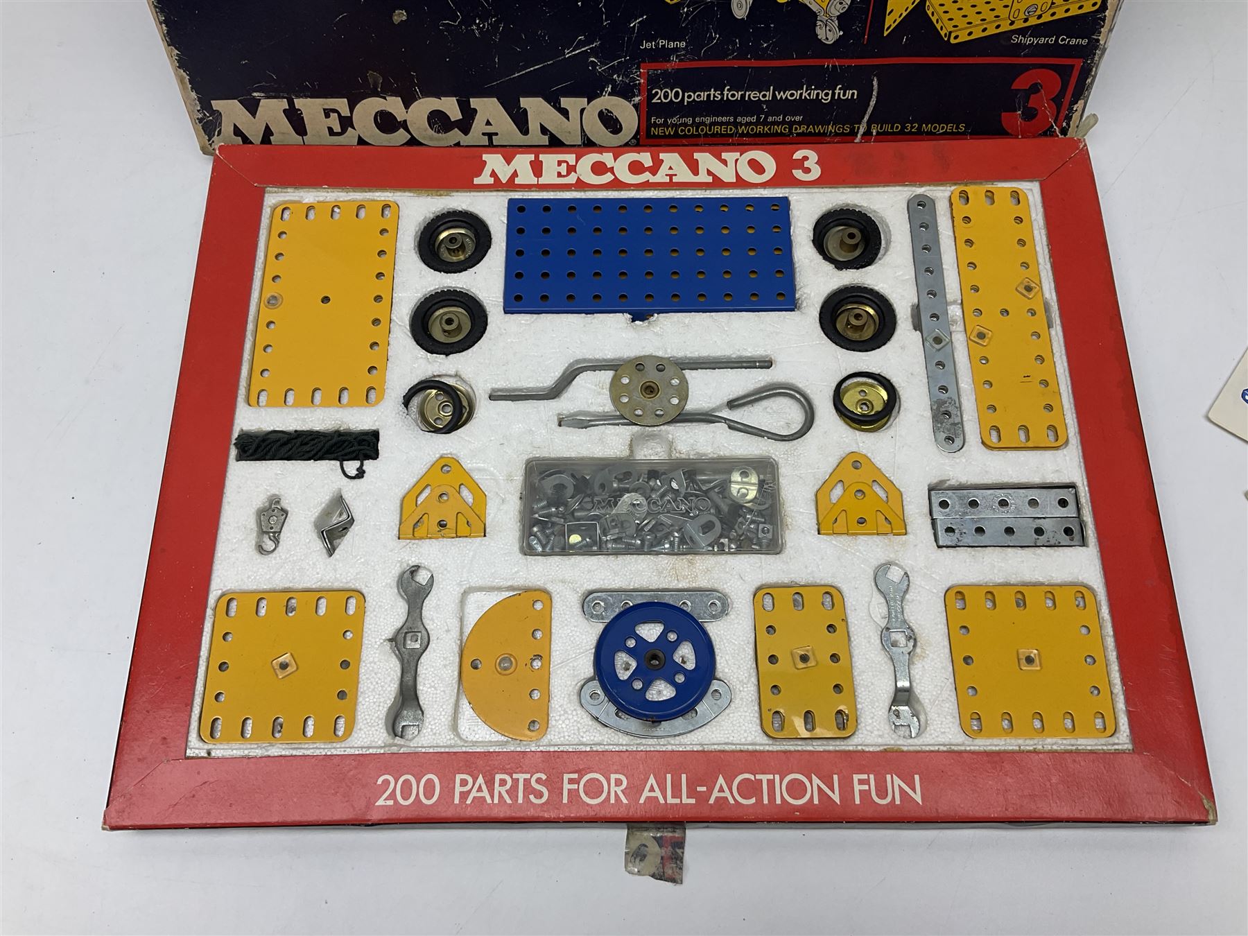 Meccano - Outfits 2, 3 & 4 with blue and yellow parts; look to be virtually complete with most apertures filled; together with a partially stocked Meccano Elekrikit; all boxed with instruction manuals (4)