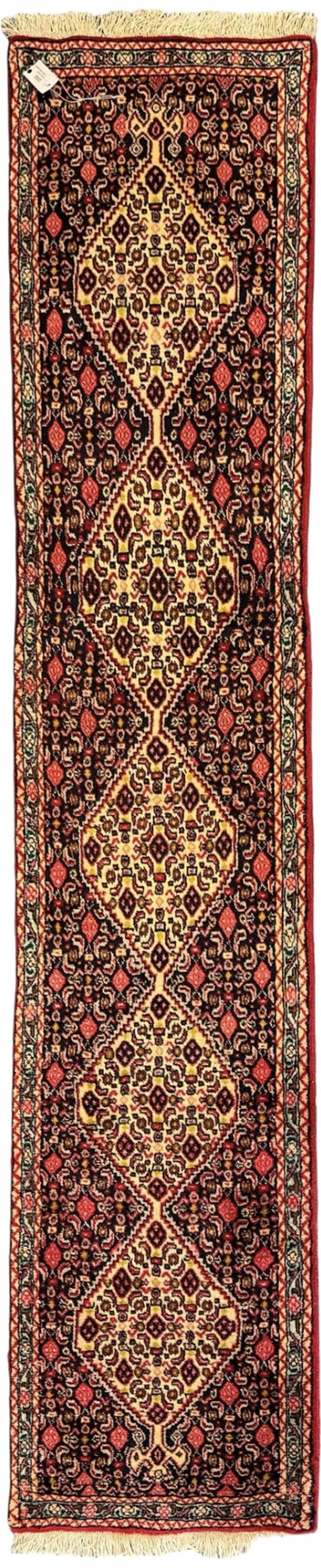 North West Persian Senneh indigo and crimson ground runner, the Herati decorated field with five interconnected lozenges, triple band border with repeating flower head motifs 