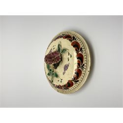 18th century creamware teapot, probably Leeds, with reeded entwined handle and floral finial to the cover, the body with hand painted polychrome decoration of figure to one side, and floral spray to the other, collectors paper label beneath inscribed Leeds Pottery, H11.5cm