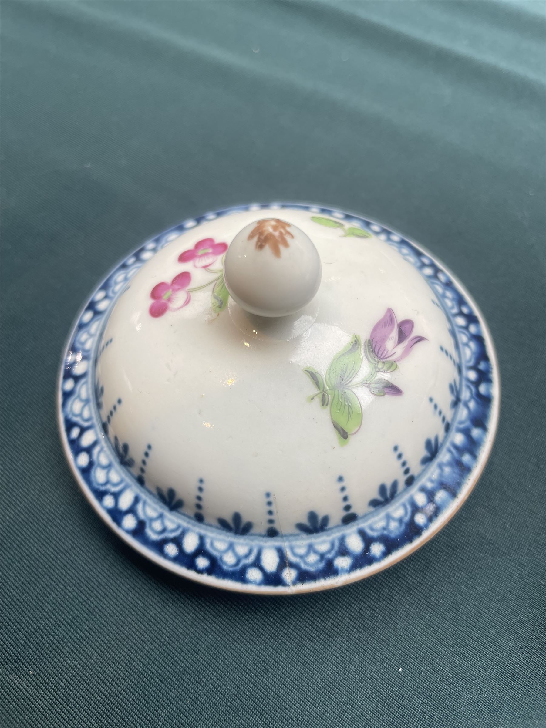 Liverpool Phillip Christian teapot and cover, c. 1775, the reeded body painted with floral sprays beneath a blue border with gilt decoration, the cover with flower-bud finial, H15.5cm; together with an 18th century Worcester teapot, with painted floral decoration (2)