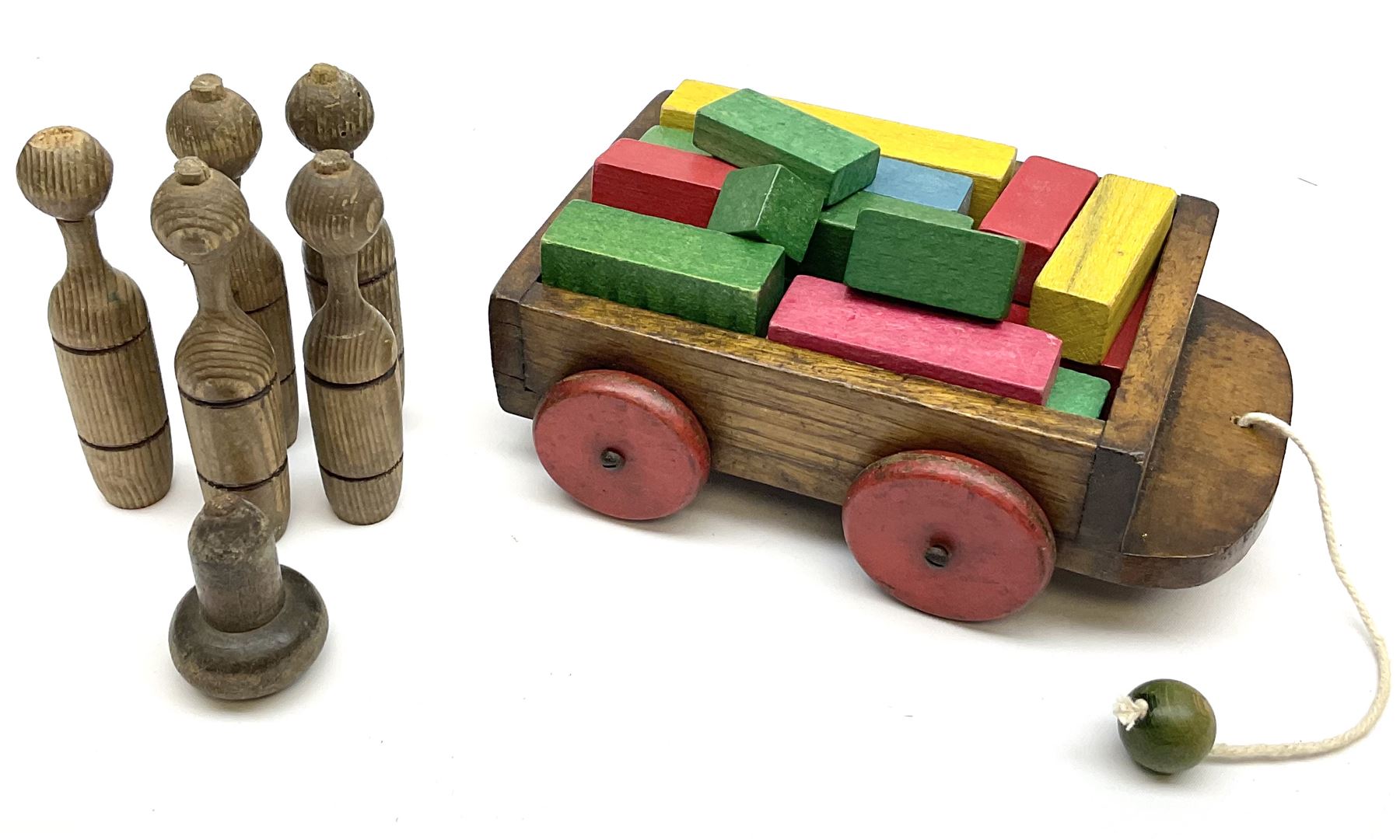 Vintage wooden toys including laundry set of washboards, clothes horse and tin wash-tub; scratch-built vehicles; building blocks; toy sweeping brush; skittles; spade; 'Titanic' deck chair; bee hive etc