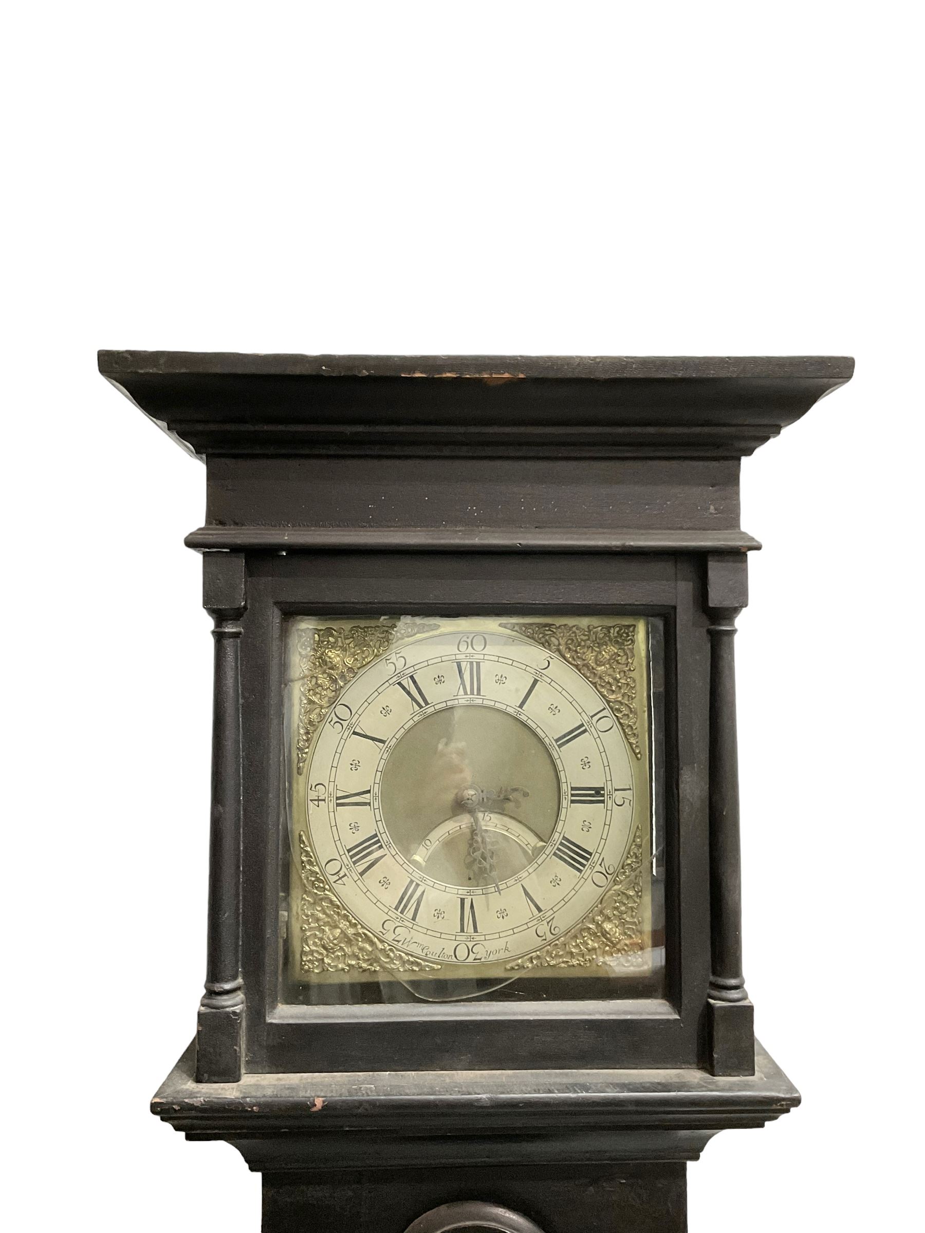 William Coulton of York - 18th century 30-hour ebonised longcase clock, with a flat pediment, broad cornice and plain frieze beneath,, square hood door with attached pillars, long break arch trunk door and rectangular plinth,  matted dial centre with curved date aperture and cast spandrels, chapter ring with Roman numerals, five minute Arabic's, minute and inner quarter hour tracks, count wheel striking movement striking the hours on a bell. With pendulum and weight.