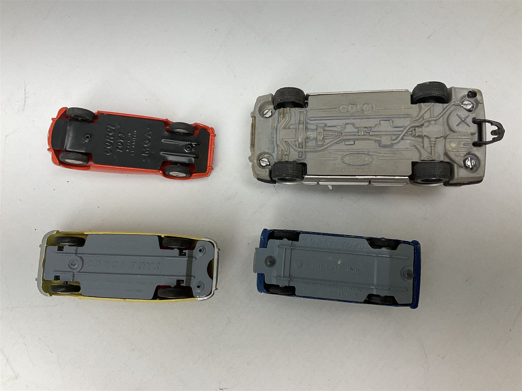 Corgi - thirty unboxed and playworn/repainted die-cast cars including Triumph Herald Coupe, BMC Mini-Cooper 'S', Porsche Carrera, two 'E' Type Jaguars, Rover 2000TC, three Morris Minors, two Aston Martin DB4, two Volvo P1800, MGA, Fiat 2100, Jaguar 2.4 Litre, Jaguar Mark X Saloon etc (30)