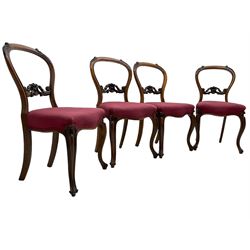 Set of six Victorian rosewood dining chairs, the balloon back carved with foliage scrolls, cartouche carved middle rail with extending scrolls, the seats upholstered in pink fabric, on carved cabriole supports with scrolled terminals 