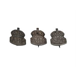 Three hallmarked silver A.R.P badges, with base metal back pins