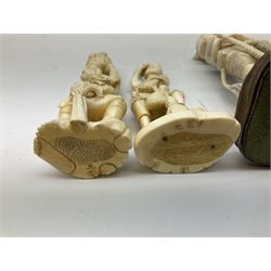 Three Japanese Tokyo School ivory figure, 19th century, comprising of man standing holding double gordes, man holding a flower with a basket on his head and a man with an adze and a basket with a frog in, tallest example H19cm, 
