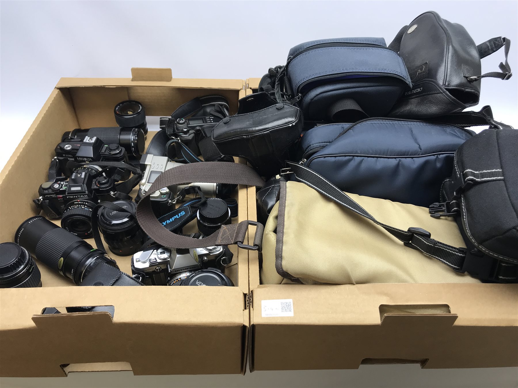 PENTAX program A camera body with RMC Tokina 28mm 1:2.8 lens, RMC Tokina 80-200mm 1:4 lens, RMC Tokina doubler for P/K, Tokina 35-70mm 1:3.5-4.8 lens, OLYMPUS OM 30 camera body with OLYMPUS OM-SYSTEM 50mm 1:1.8 lens, Miranda 28-70mm 1:3.8-4.8 MC macro lens, Makinon MC Zoom1:4.5 80-200mm lens, Minolta X-370s camera body with Minolta MC Rokkor-PF 1:17 lens, two Olympus cameras, Minolta AF Zoom 35-105mm lens, Minolta MAXXUM AF zoom 100-300mm lens, 