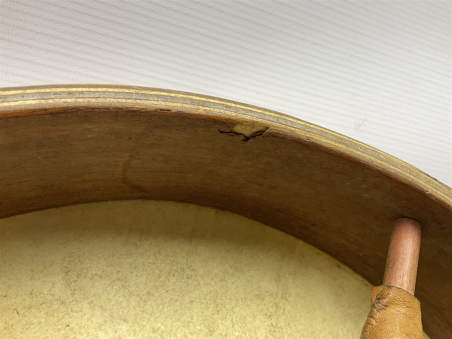 Dulcet eight-string banjo mandolin with mother-of-pearl inlaid ebonised fingerboard L55.5cm; cased; and Irish mahogany bodhran hand drum with inlaid stringing and vellum top D46.5cm; in soft carrying case with double ended beater (2)