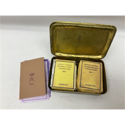 WWI Princess Mary Christmas 1914 brass gift tin containing imitation copies of packets of tobacco, cigarettes and greeting card; together with a WWI oak and steel trench gas rattle marked A. & N.C.S. (Army & Navy Cooperative Society) and broad arrow above '79' above 'G'