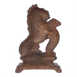 Victorian cast iron doorstop in the form of a rampant lion on a plinth base, together with cast iron Mr Punch doorstop, lion H39cm
