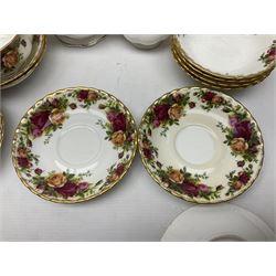Royal Albert Old Country Roses pattern coffee set for four, comprising coffee pot, milk jug, cups and saucers, cake plate, together with six dinner plates, side plates etc (34) 