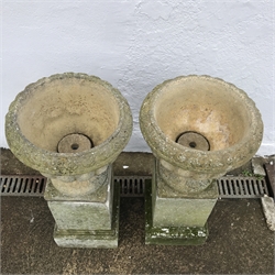  Pair composite planters on plinths, D38cm, H81cm  
