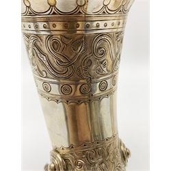 Late 19th century Danish silver drinking horn and cover, the body with hexagonal and beaded finial, raised upon two talon feet and further scroll foot, chased with scrolling foliate and zoomorphic bands, the detachable domed cover with conforming decoration surmounted by a figure holding a hammer, the cover interior impressed with maker's mark (partly worn and indistinct), alongside Danish Three Towers mark for 1881, with the Assay Master mark for Simon Groth (1863-1904), H23.5cm, weight 14.75 ozt (459 grams)

