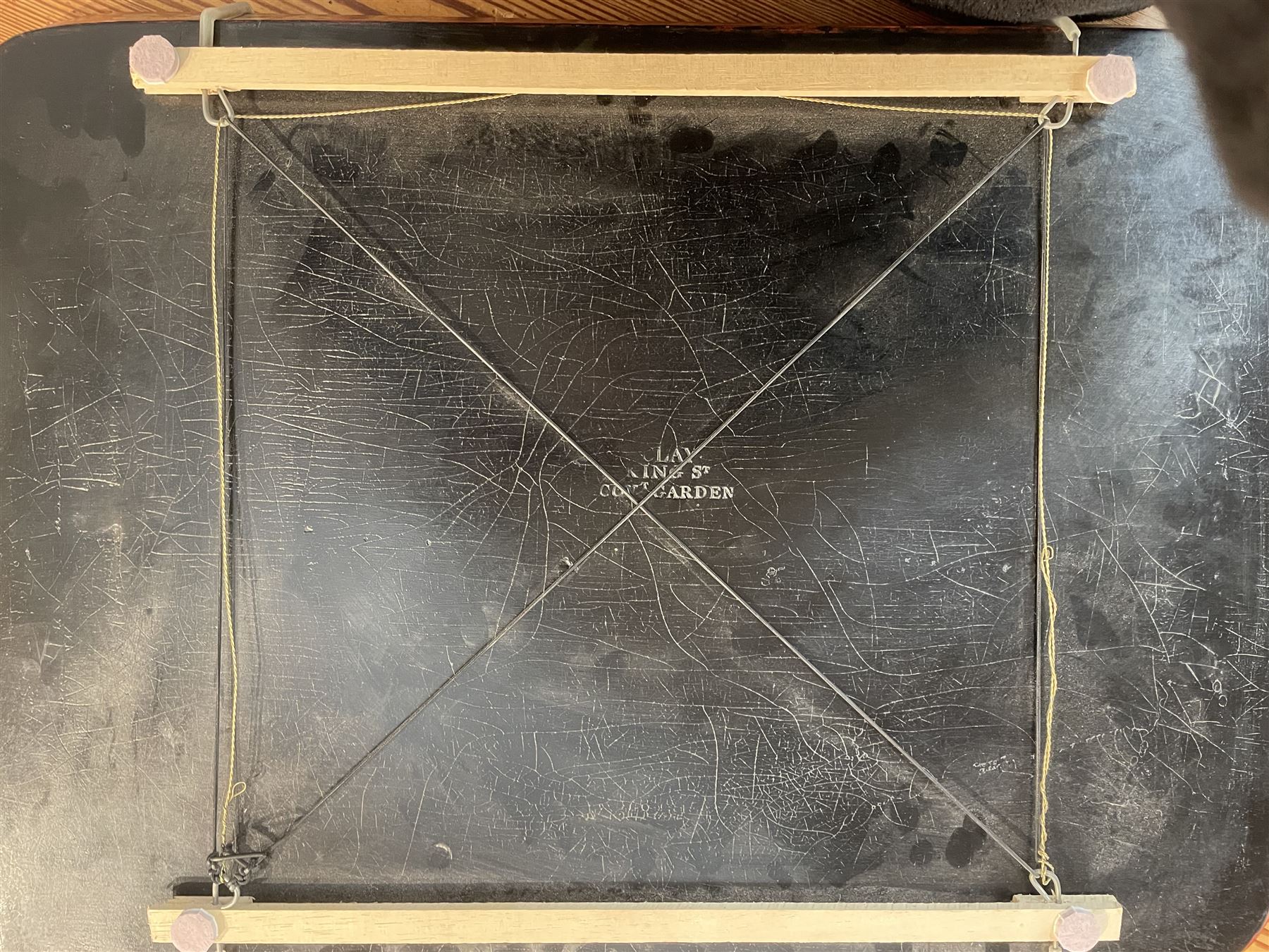 Early 19th century red lacquered papier-mâché tray by Clay of King Street Covent Garden, of rounded rectangular form, painted in gilt with large foliate sprays and butterflies, impressed verso CLAY KING ST COVENT GARDEN, W66.5cm D48.5cm