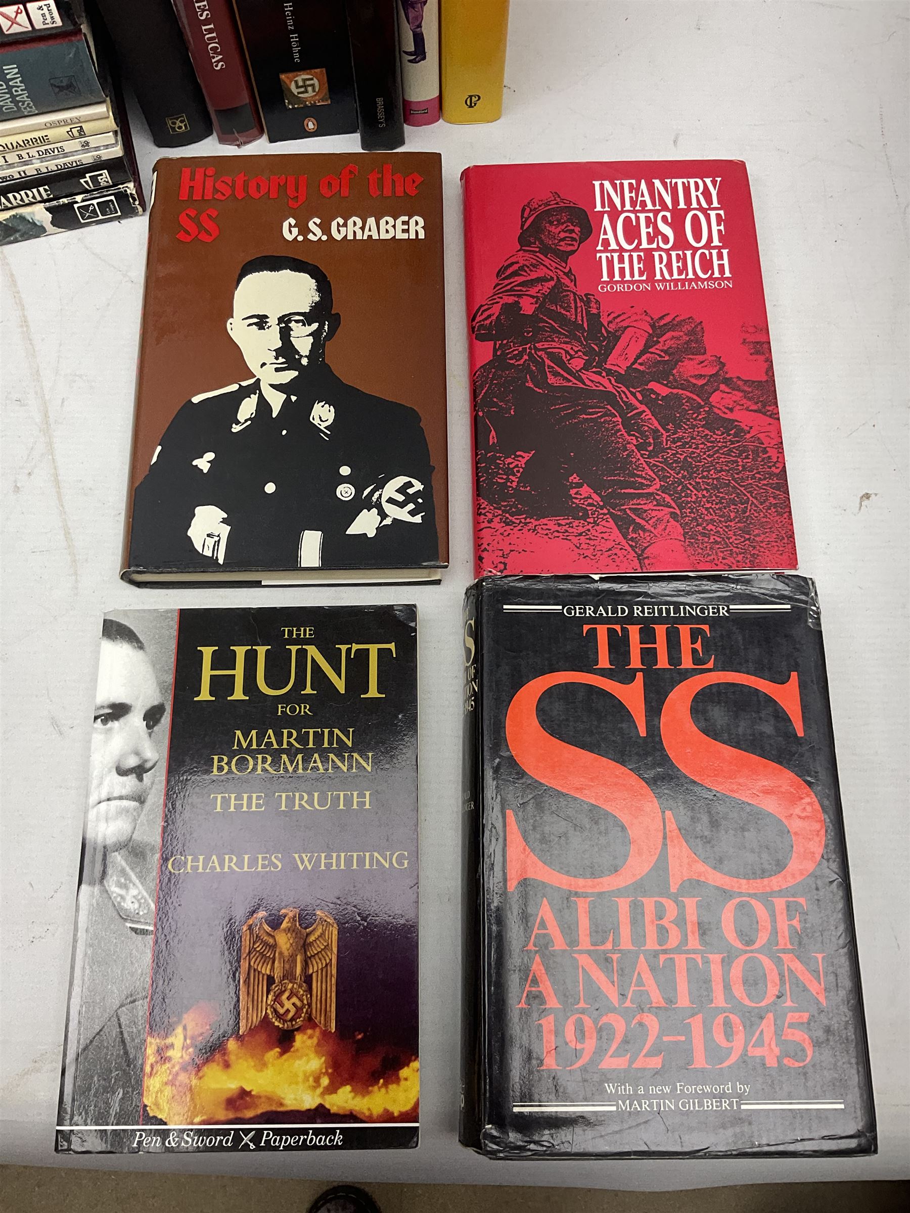 Twenty-six books of WW2 German interest with particular emphasis on the 'SS', including Charles Sydnor: Soldiers of Destruction; G.S. Graber: History of the 'SS'; Bruce Quarrie: Hitler's Samurai; David Cesarini: Eichmann - His Life and Crimes; collector's reference books etc (26)