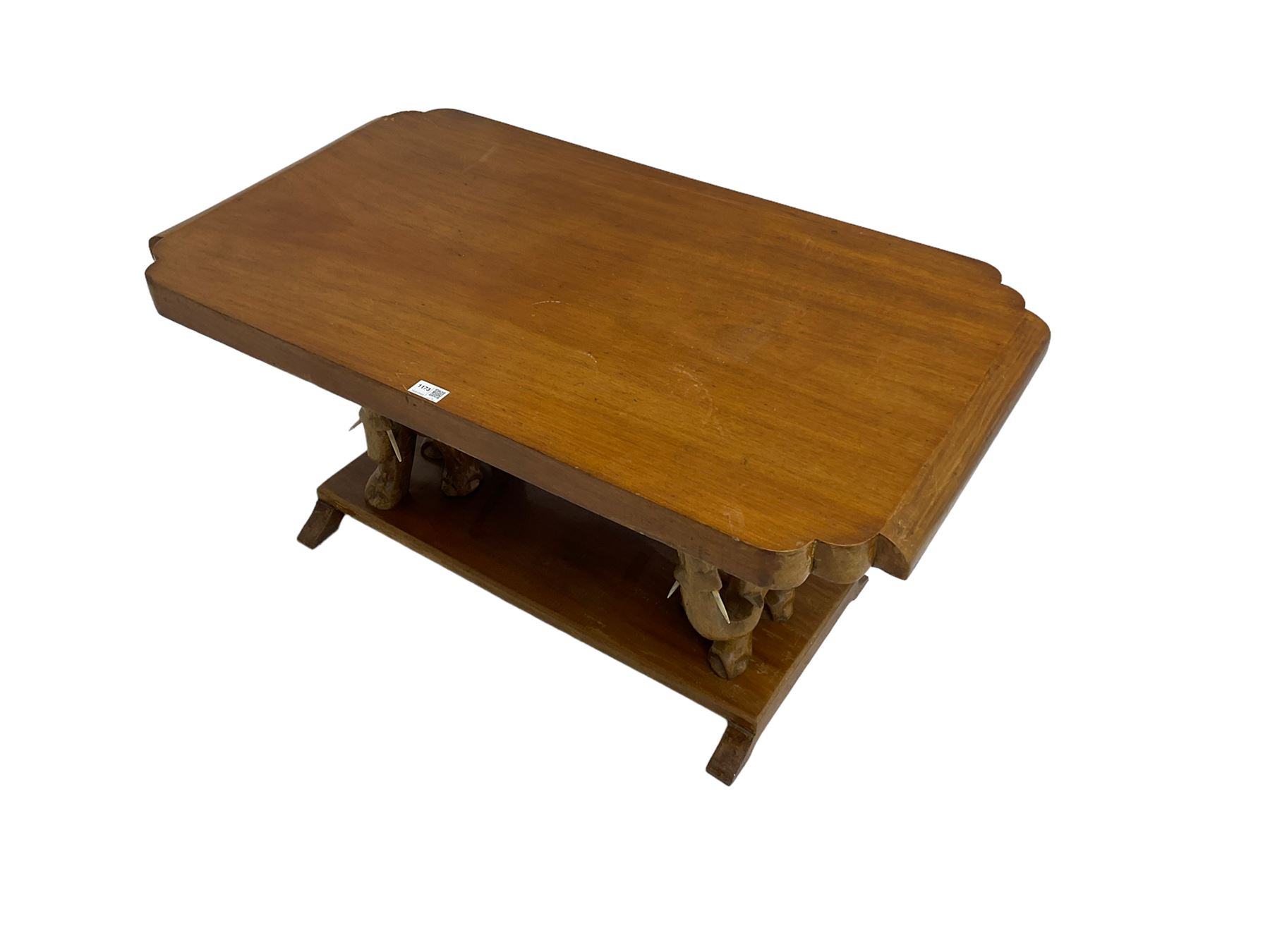 Hardwood coffee table on carved elephant figure supports, platform base on sledge feet