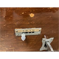 Early 20th Century Time Recorders Leeds Ltd mahogany cased clocking in machine, the square silvered dial with Arabic numerals above clocking in mechanism on plinth base, with a collection of blank clocking in cards, case H98cm