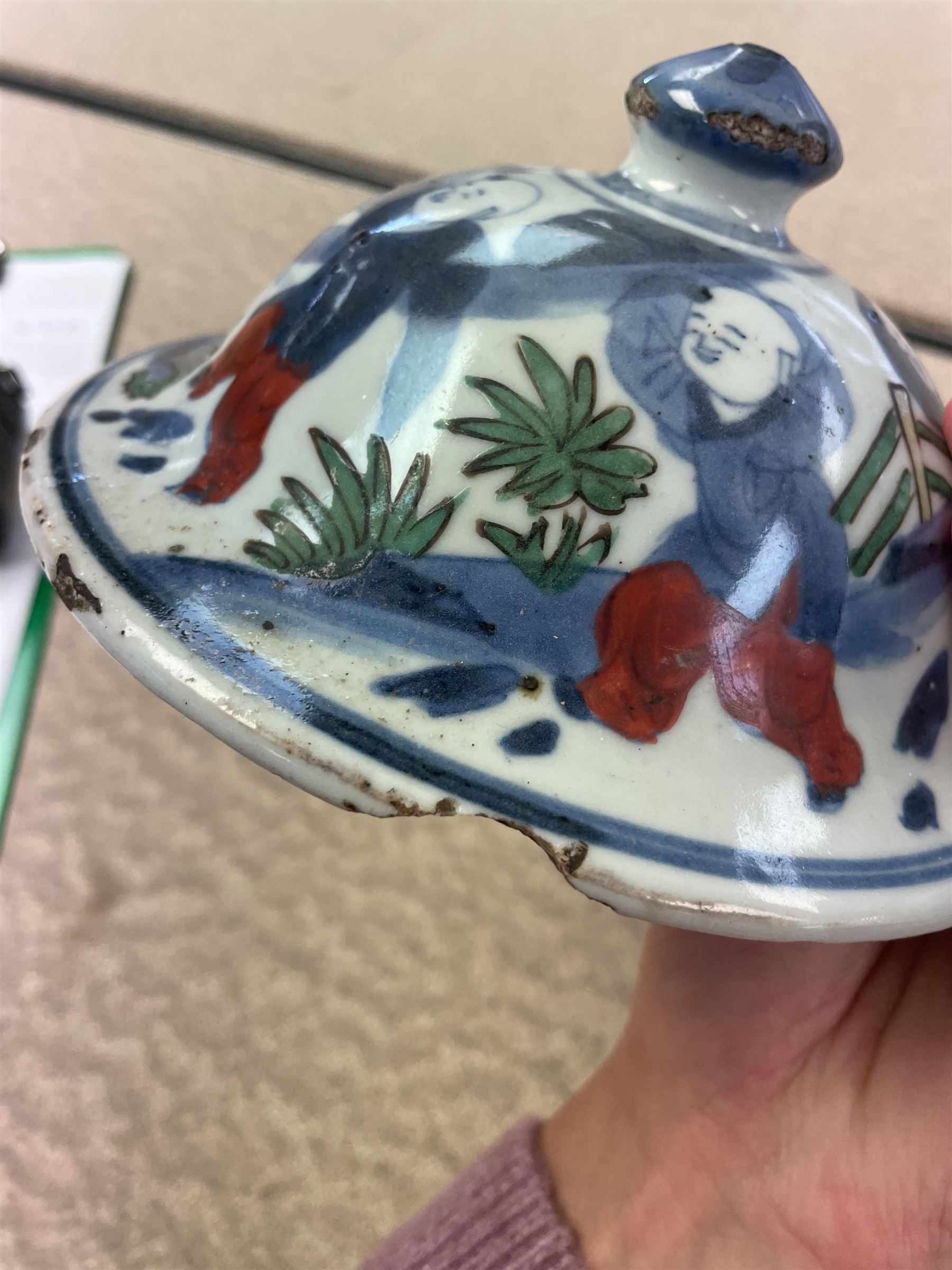 17th century Transitional period Chinese Wucai vase and cover, of baluster form, the body painted with ladies upon a terrace, and figures upon horseback and attendants within a fenced garden, the domed cover with knop finial painted with boys at play, H37cm
