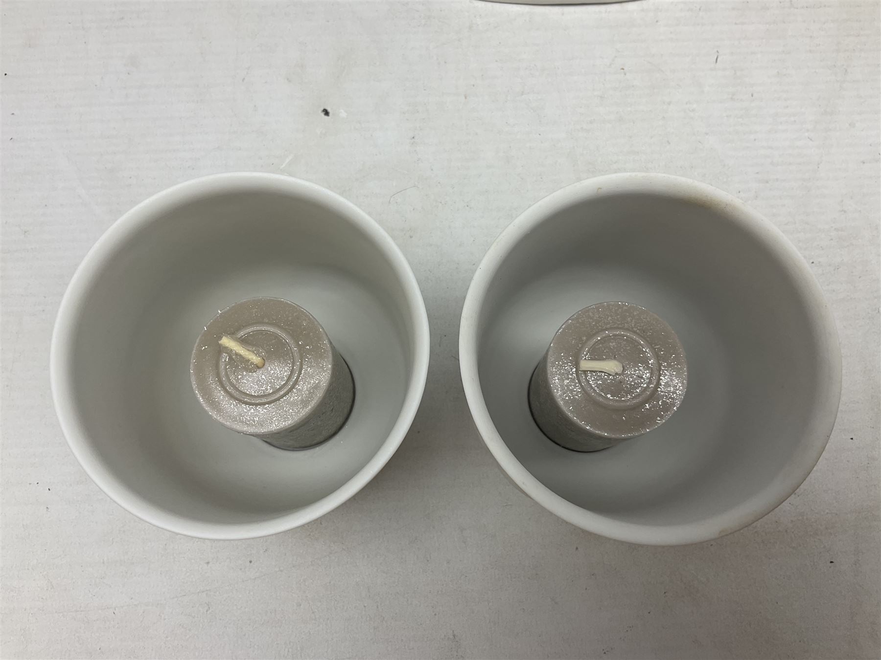 Two Lladro figures, comprising Conductor no 5196 and Prayerful Moment no 5500 together with a Lladro plaque and two Lladro candle holders, Dolphins at Play no 17666 and Sailing the Seas no 17665, all with original boxes, largest example H33cm 