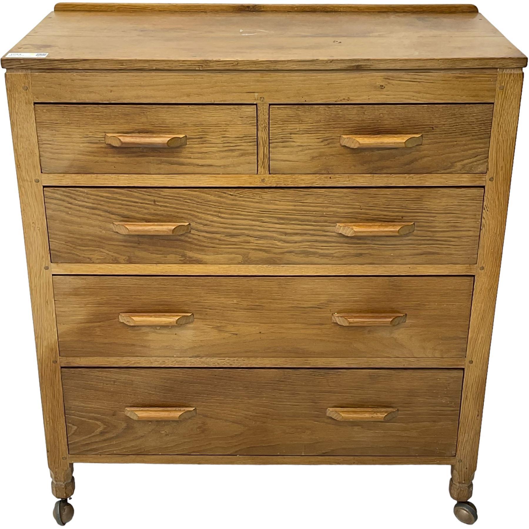 Yorkshire Oak - oak chest, fitted with two short over three long drawers, on octagonal feet with castors 