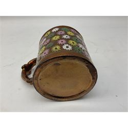 Five 19th century blue and white Delft tiles, each decorated with a central circular panel, containing buildings, boat, and swan, and a Victorian lustre mug decorated with polychrome flowers, tiles H13cm W13cm. 