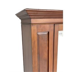 Edwardian walnut single wardrobe, projecting cornice over panelled front and bevelled mirror glazed door, single drawer to base