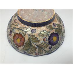 Charlotte Rhead for Crown Ducal ceramics, comprising coffin shaped vase depicting a woman in 1920s dress, a vase with handle, decorated with autumn leaves and a bowl, decorated with flowers and berries, with printed and signed marks beneath, coffin vase H24cm