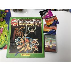 Five 1980s LJN Thundercats figures - Lion-O with sword, Snowman, S-S-Slythe, Tygra and Mumm-Ra; all re-bagged on original backing cards; partially stocked Panini sticker album; story cassette tape and three catalogues; together with Ghostbusters Slimer with food and Comic