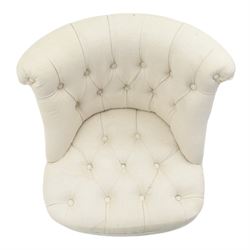 Victorian style upholstered tub chair, buttoned cream fabric back and seat with rolled sides, on ebonised turned front supports with brass castors and splayed rear supports