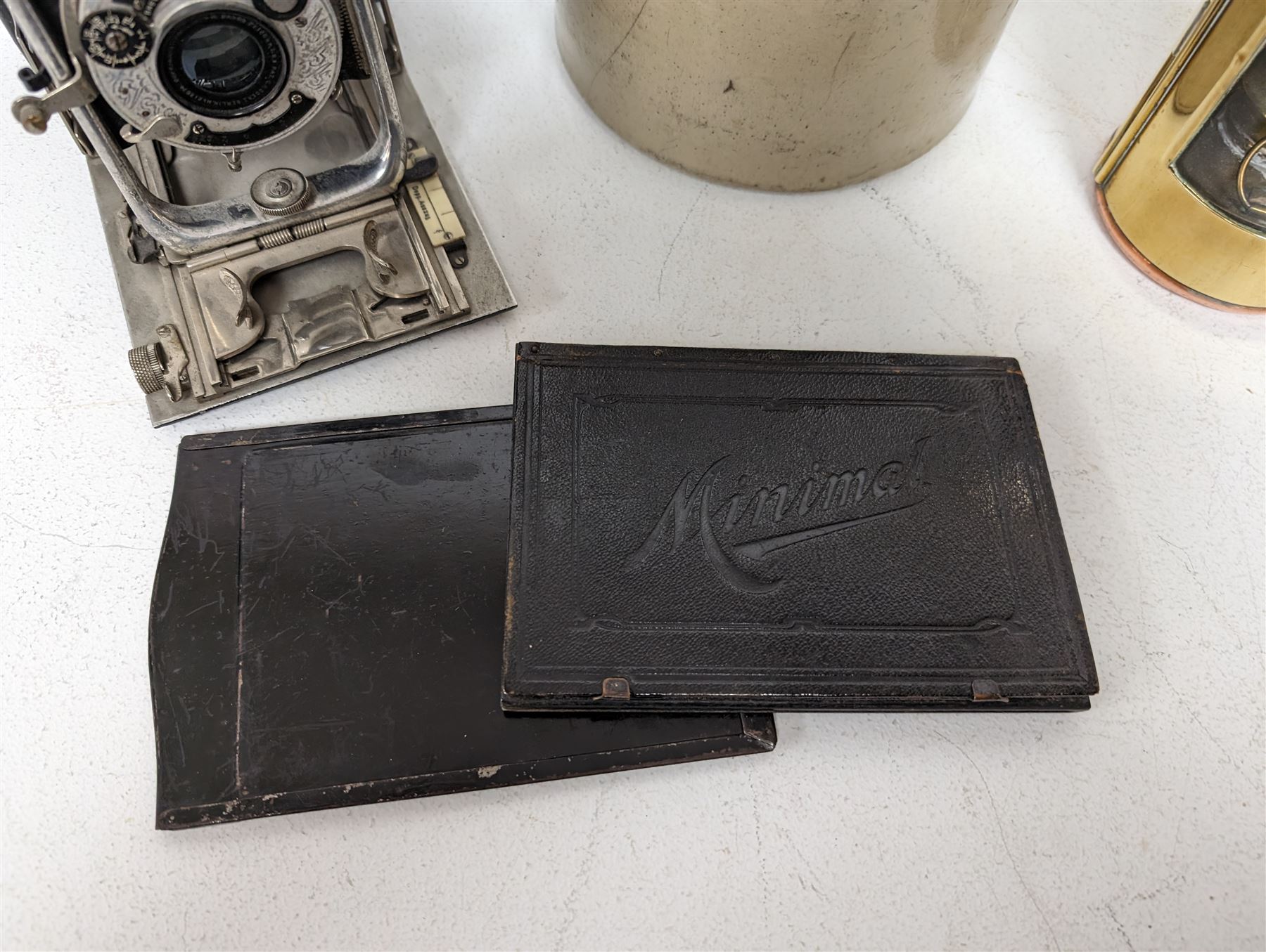 Watt & Ferguson Botanical Brewers stoneware flagon, together with a Sherwoods copper and brass lamp and a Koilos Minimal plate camera, flagon H26.5cm