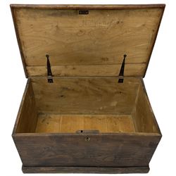 Small 19th century stained elm blanket chest, rectangular hinged top, with twin metal carrying handles, on skirted base