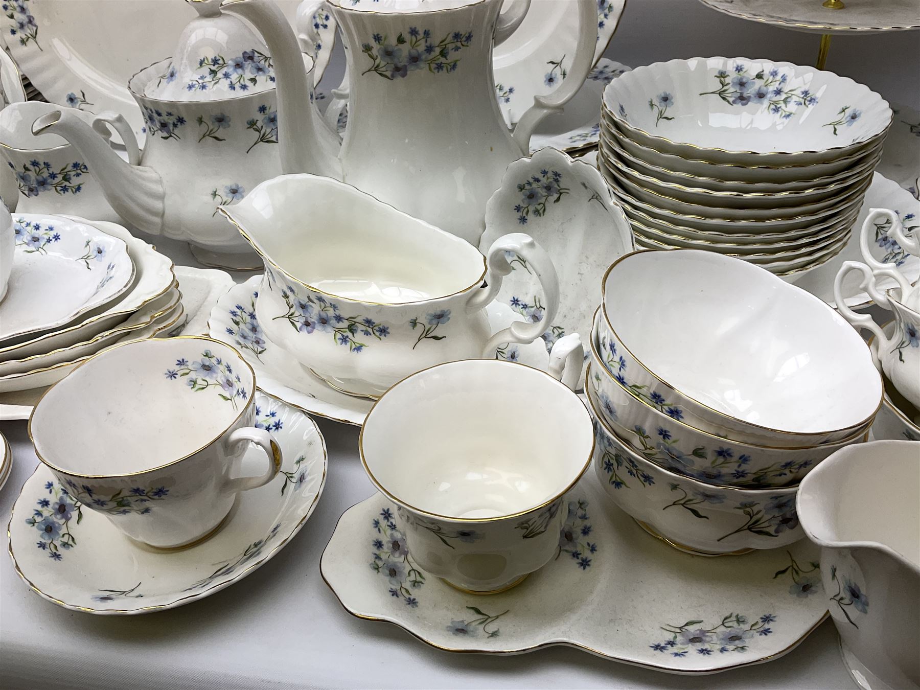Extensive Richmond Blue Rock pattern part tea and dinner service, to include seven dinner plates, nine smaller plates, three lidded twin handled tureens, two teapots and two coffee pots, eleven bowls, cake stand, six twin handled soup bowls and saucers, six teacups, four coffee cups, milk jugs, sucrier, cake plate, salt and pepper shakers, other plates, dishes, bowls, side plates and many spares etc