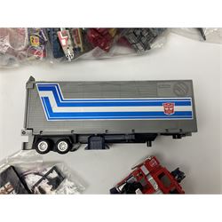 Four 1980sTransformer G1 - Optimus Prime 1984; DinoBot Sludge (Diplodocus) 1984; Cyclonus 1986; and Runamuck 1986; with paperwork; seven Bandai Robo Machines Robots/Transformers; almost fully stocked Panini Sticker album; two annuals; three comics; two posters; and Ladybird story book