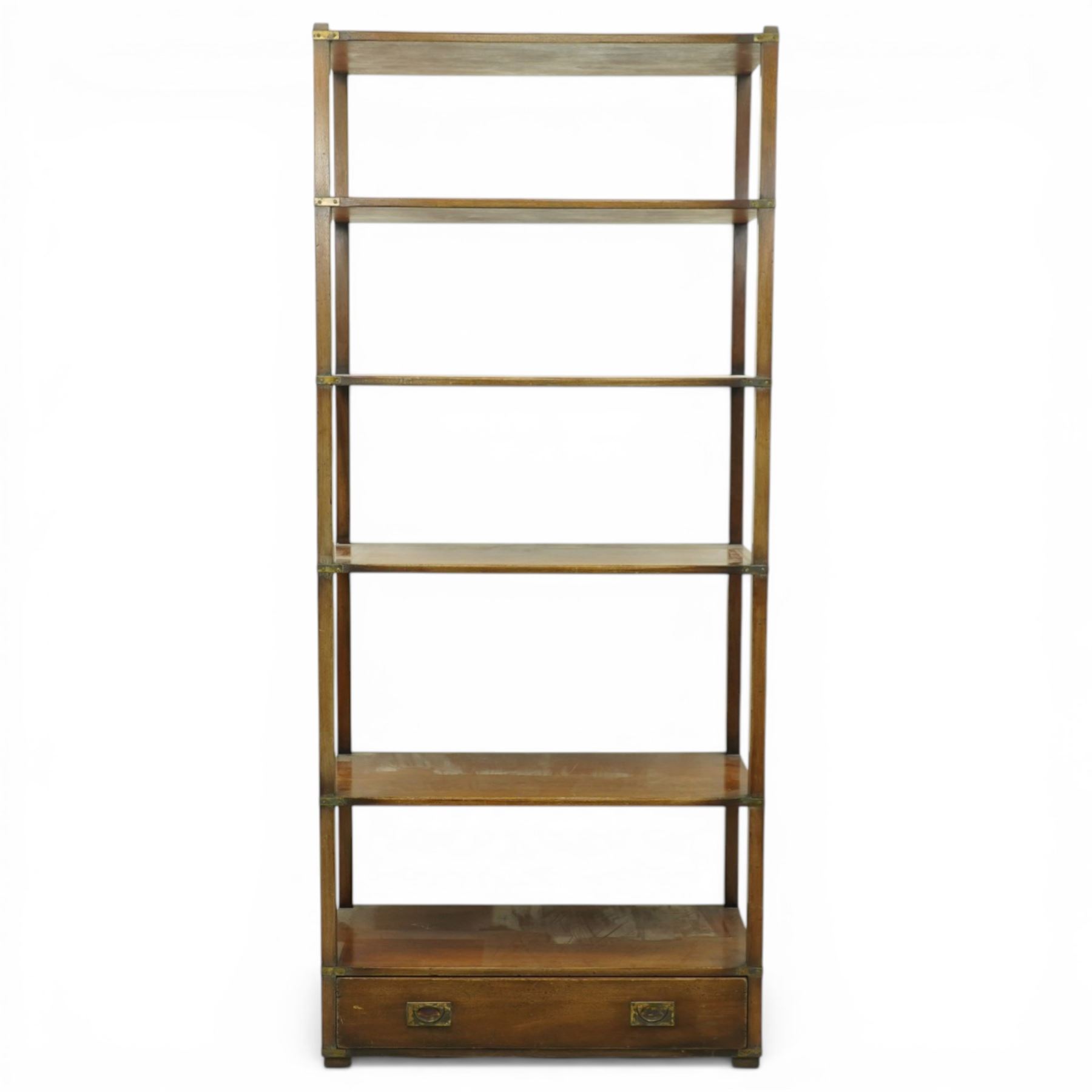 Late 20th century mahogany open bookcase, rectangular form with five open shelves and brass mounted corner brackets, fitted with single lower drawer with recessed brass campaign handles, on block feet