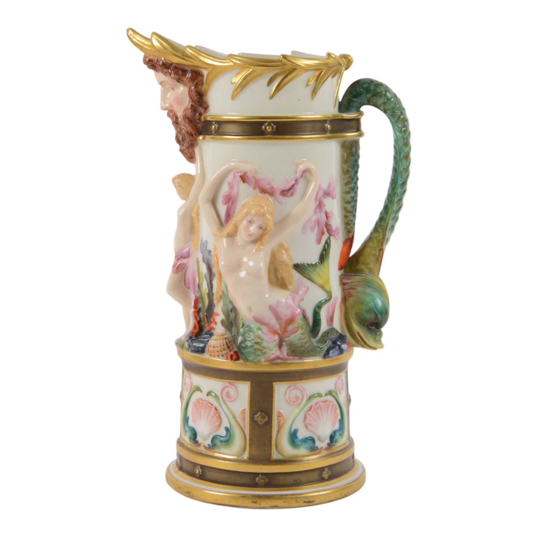 Royal Worcester Neptune pitcher, decorated in relief with mermaids, shells and seaweed above a panelled band of dolphins and shell, dolphin modelled handle and Neptune mask spout, with green mark beneath, H25cm