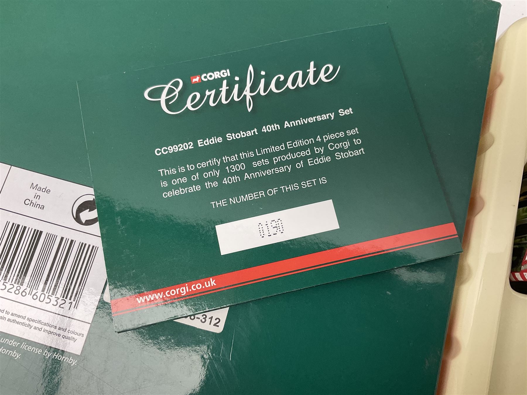 Corgi Eddie Stobart - two limited edition Hauliers of Renown sets; CC99203 Edward Stobart 1954-2011 Commemorative Set; and CC99202 1970-2010 40th Anniversary Set; both boxed (2)