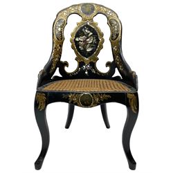 19th century Papier Máchê and black lacquered bedroom chair, shaped cresting rail painted with floral vignette over shaped splat decorated with painted gilt foliage and floral mother of pearl inlays, cane work seat, on cabriole supports