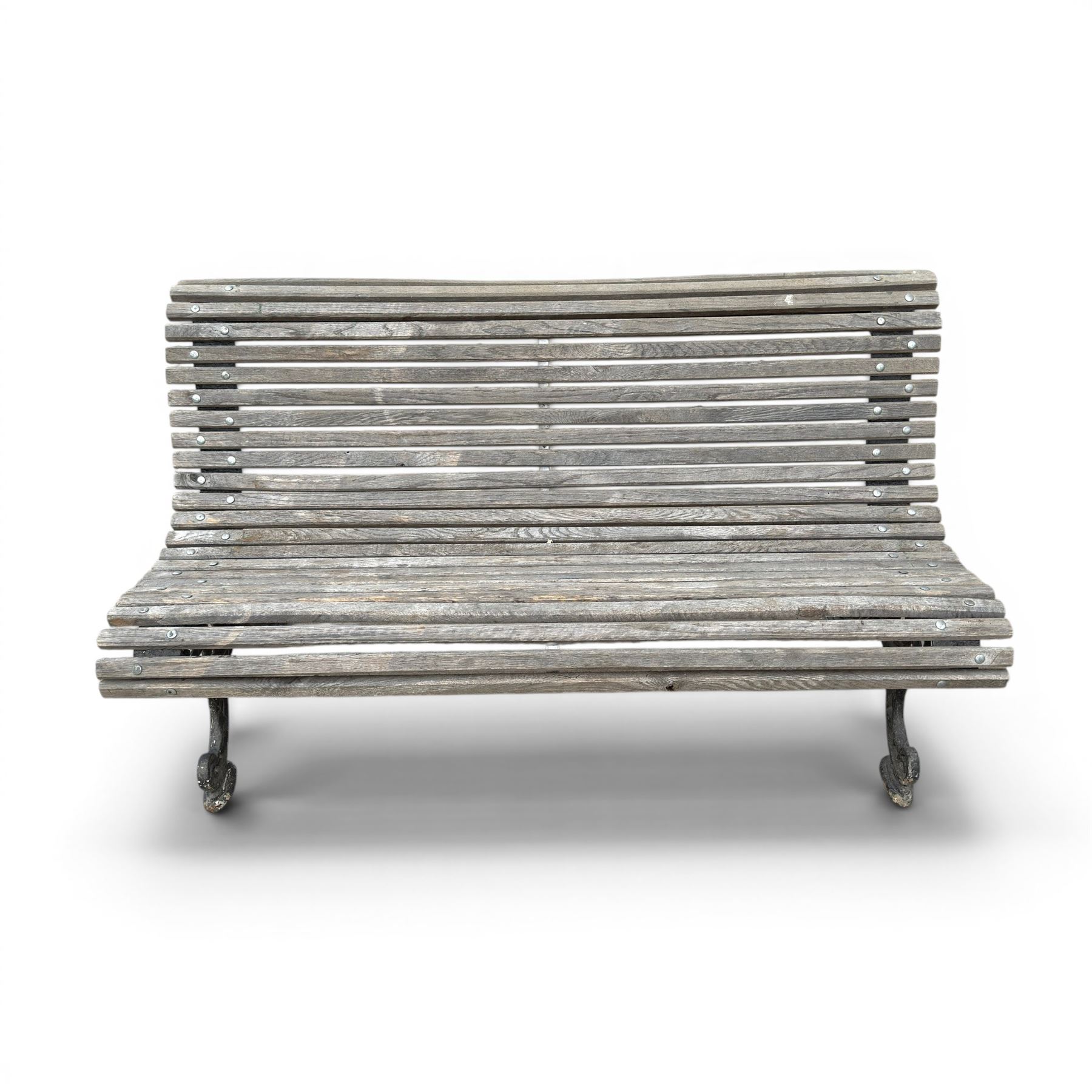 19th century cast iron and wood slatted garden bench, serpentine scroll form, ornate bow ends finished in green paint