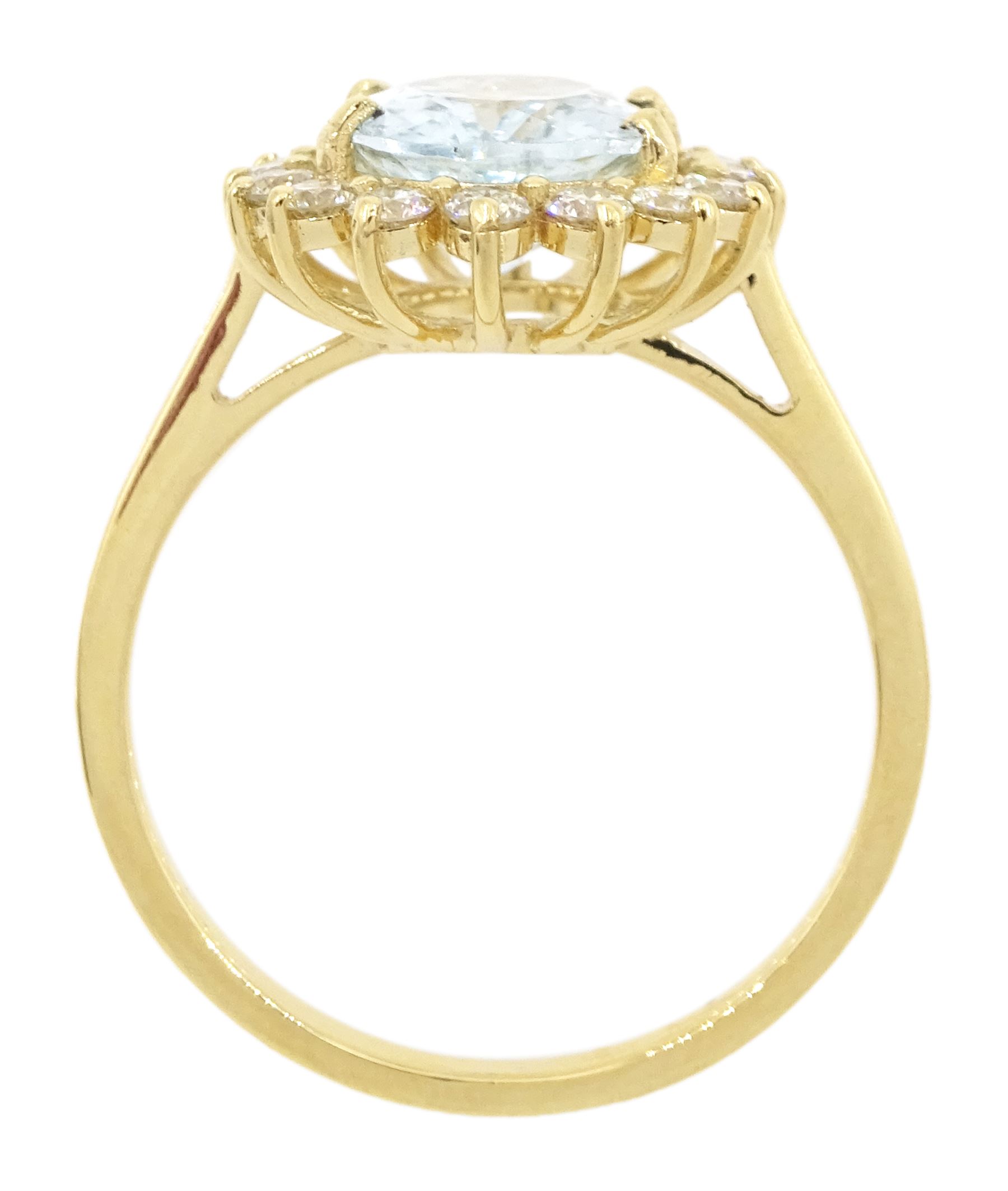 18ct gold oval cut aquamarine and round brilliant cut diamond cluster ring, stamped, aquamarine approx 1.90 carat, total diamond weight approx 0.50 carat