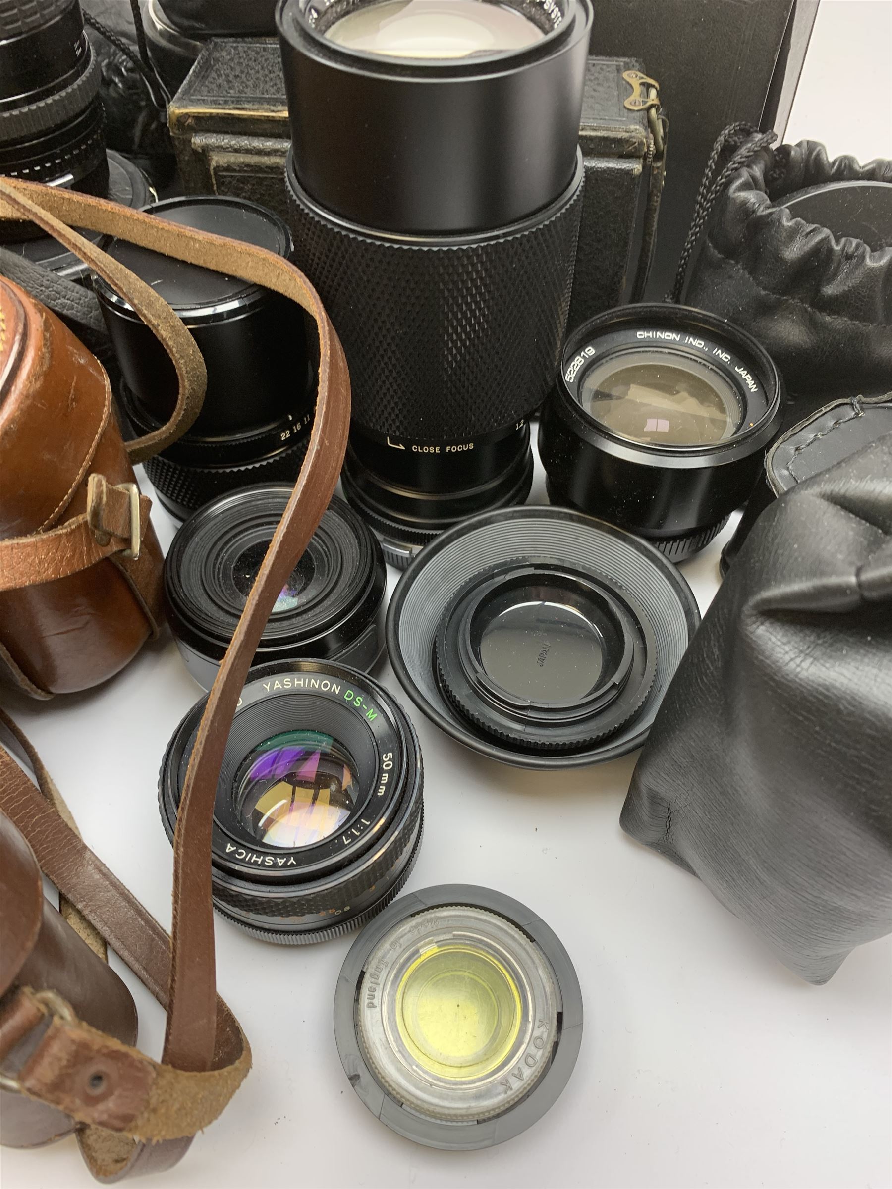 Vintage cameras lenses and accessories including Olympus 'OM10' camera body, Olympus 'OM4' camera, 'Olympus OM-System Zuiko auto-zoom 35-70mm 1:4' lens, various other lenses, tasco binoculars etc, in one box