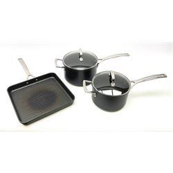 Three Le Creuset pans suitable for induction hobs inc. griddle pan, 20cm & 18cm pans with glass lids