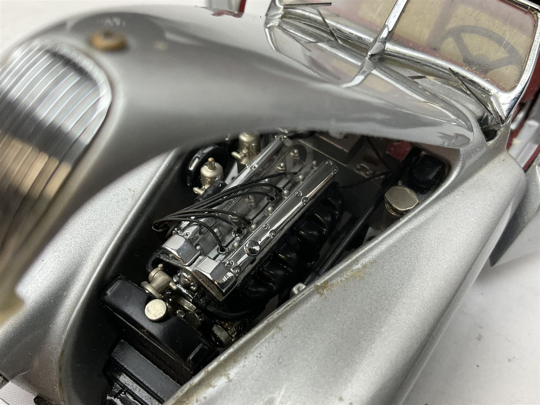 Four Franklin Mint Precision Models, one with hardwood body; large reproduction model of a vintage racing car L52cm; and four other modern metal/wooden models of vintage cars; all unboxed (9)