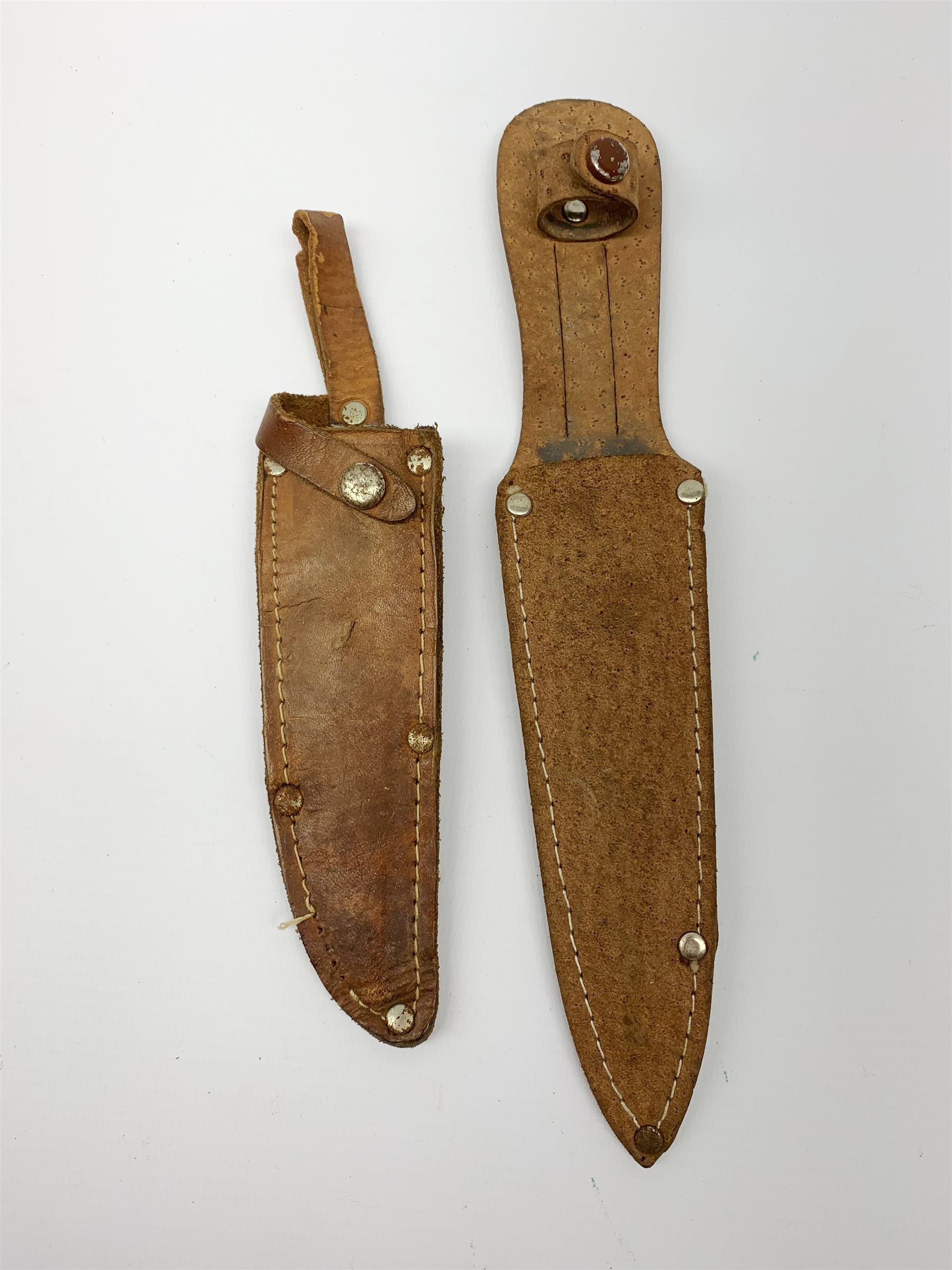 20th century hunting knife with 13cm single edge blade, cast white metal hilt with S-shaped quillon, wrythen grip and eagle head pommel L25cm overall; and another hunting knife with Solingen 12cm blade and simulated stag antler grip, both in leather sheath (2)