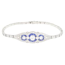 Art Deco platinum diamond and sapphire target design bracelet, five old cut diamonds, surrounded by calibre cut sapphires and old cut diamonds, all milgrain set, to a graduating old cut diamond and polished articulated rectangular link bracelet, the sides with engraved foliate decoration, French import mark, principal diamond approx 0.45 carat